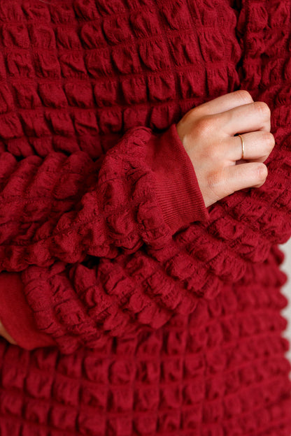 In Denial Bubble Pullover Sweater in Crimson